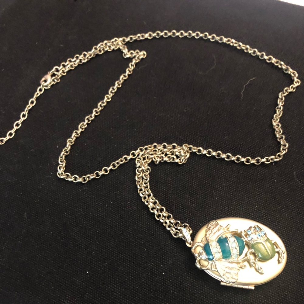 Locket with turquoise bee and rhinestones. 31” w 2” extender.  Coldwater Creek.